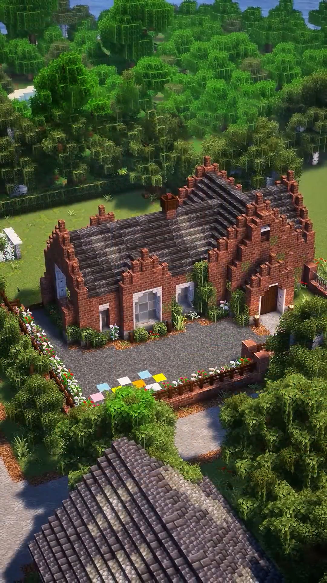 Simple British manor design with brick gables and green details