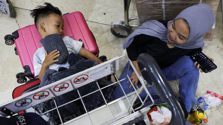 Stranded passengers at Soekarno-Hatta International Airport. Pic: Reuters