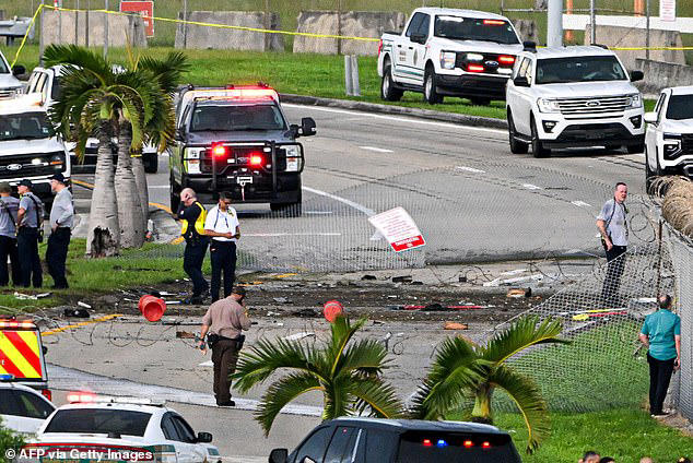Officials are seen investigating the runway incursion on Sunday evening