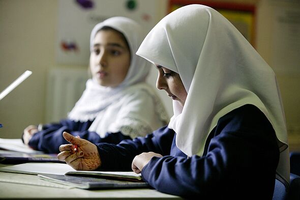 Girls Studying Numeracy wearing headscarves