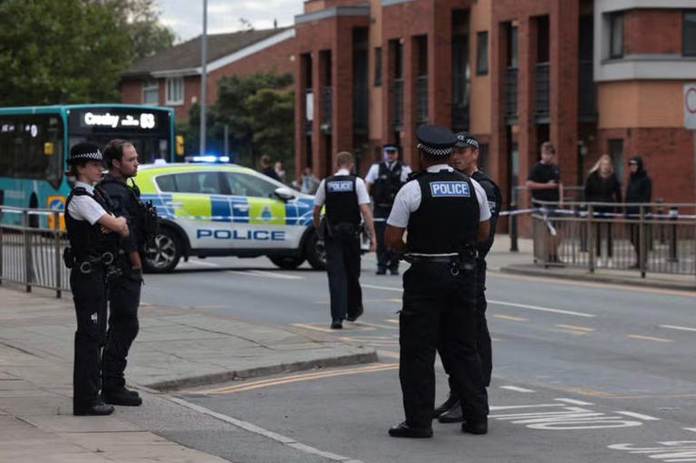 Police at the scene after a man reportedly opened fire in Bootle