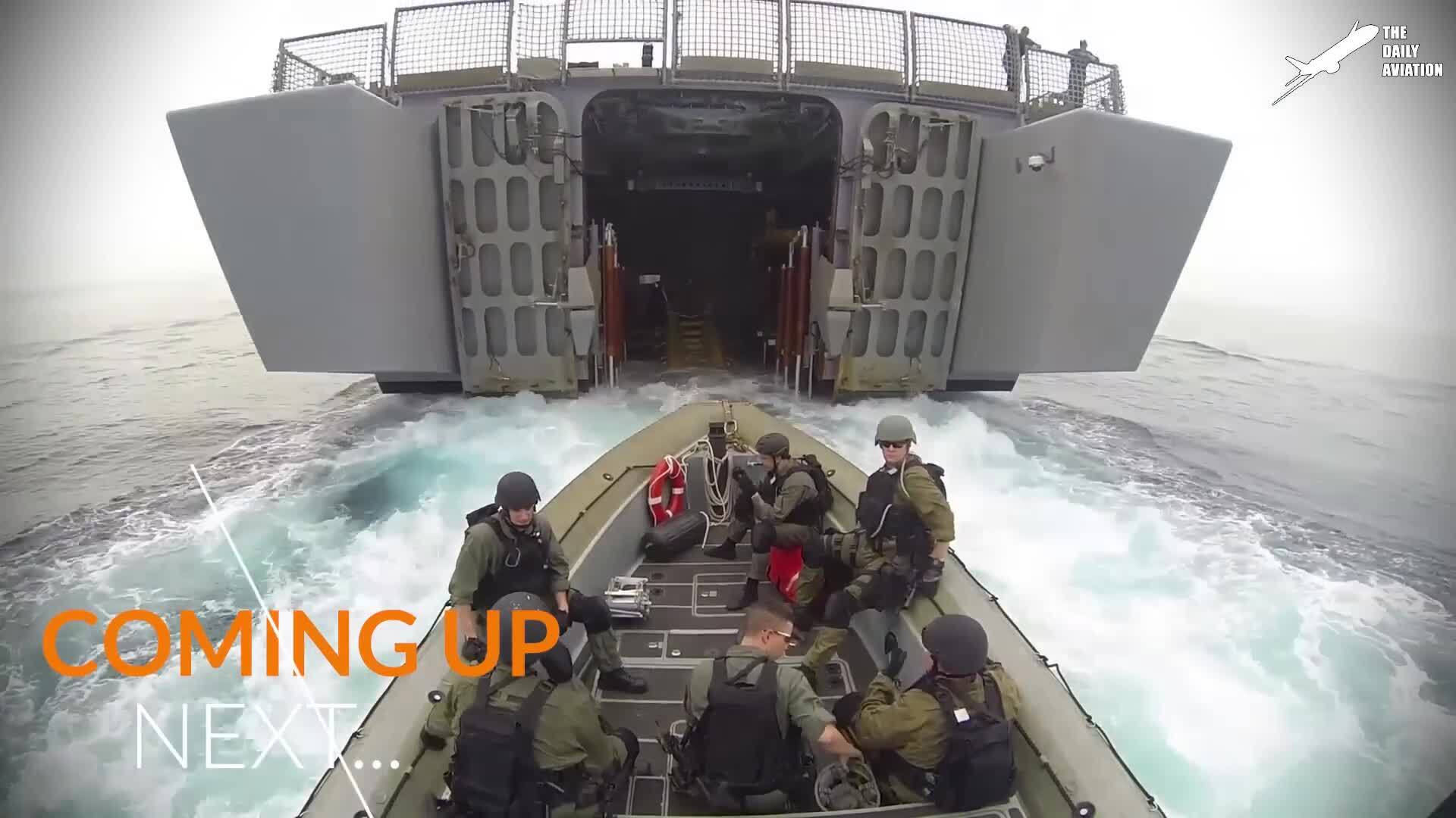 See a futuristic US Navy ship in action during a high-seas patrol