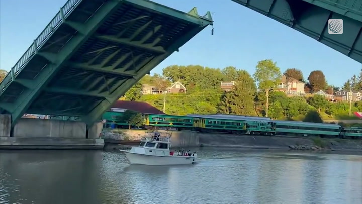Bascule bridge lifts to let a boat pass