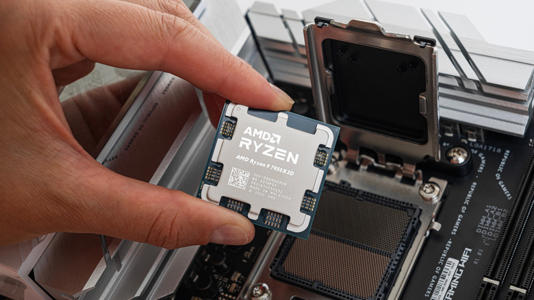 AMD Ryzen processor being installed into a motherboard CPU socket