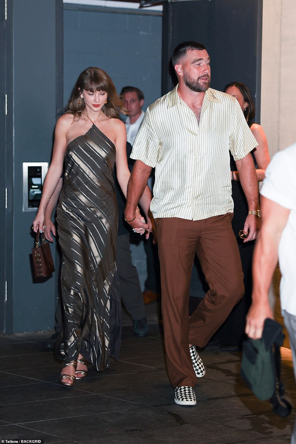 Taylor Swift and Travis Kelce flaunt wedding rings at NYC dinner
