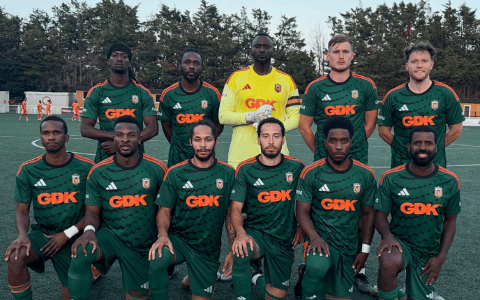 George Desmond Kamurasi, in yellow, is the captain and goalkeeper of SE Dons (SE Dons/Instagram)