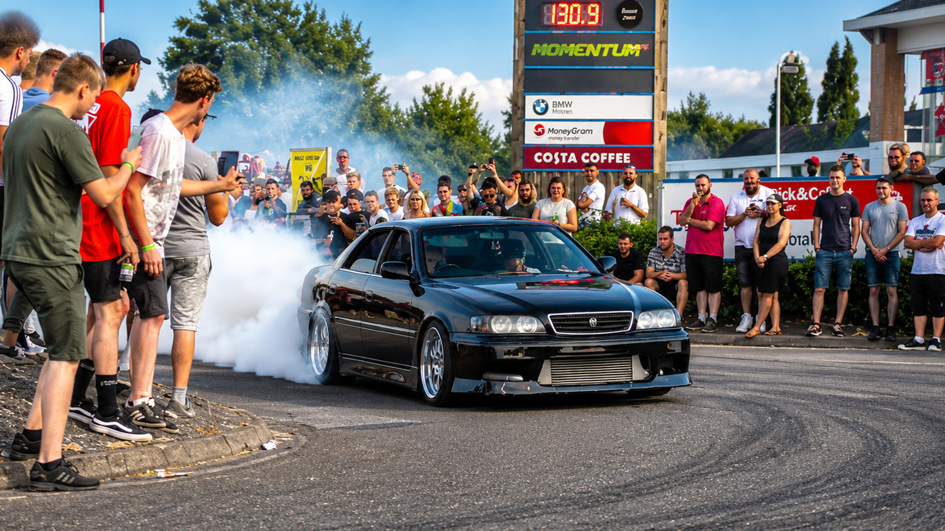 Tuner cars fill the road with smoke leaving a Mexico car meet
