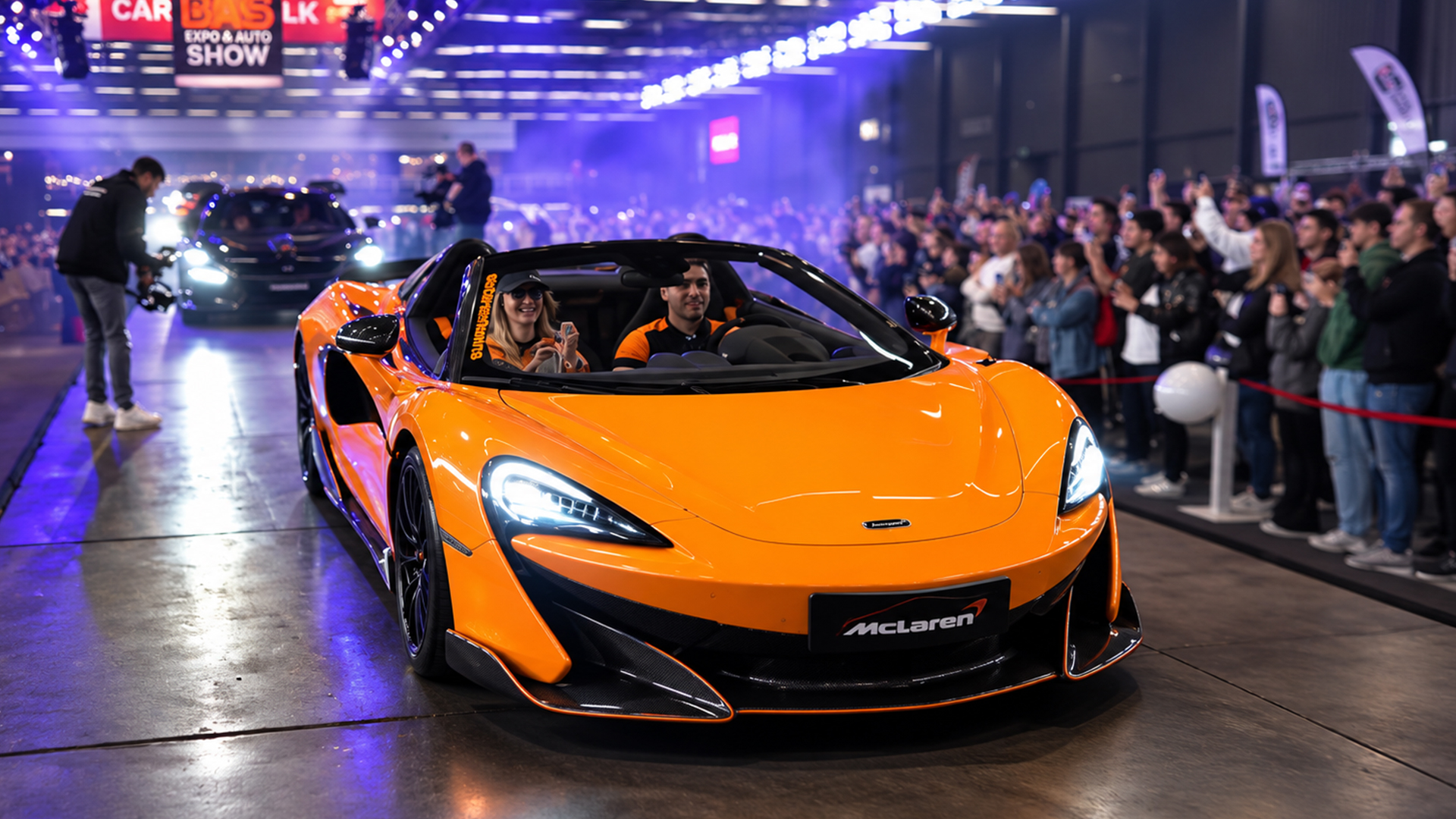 McLaren 600LT rolls onto the stage at a packed car show