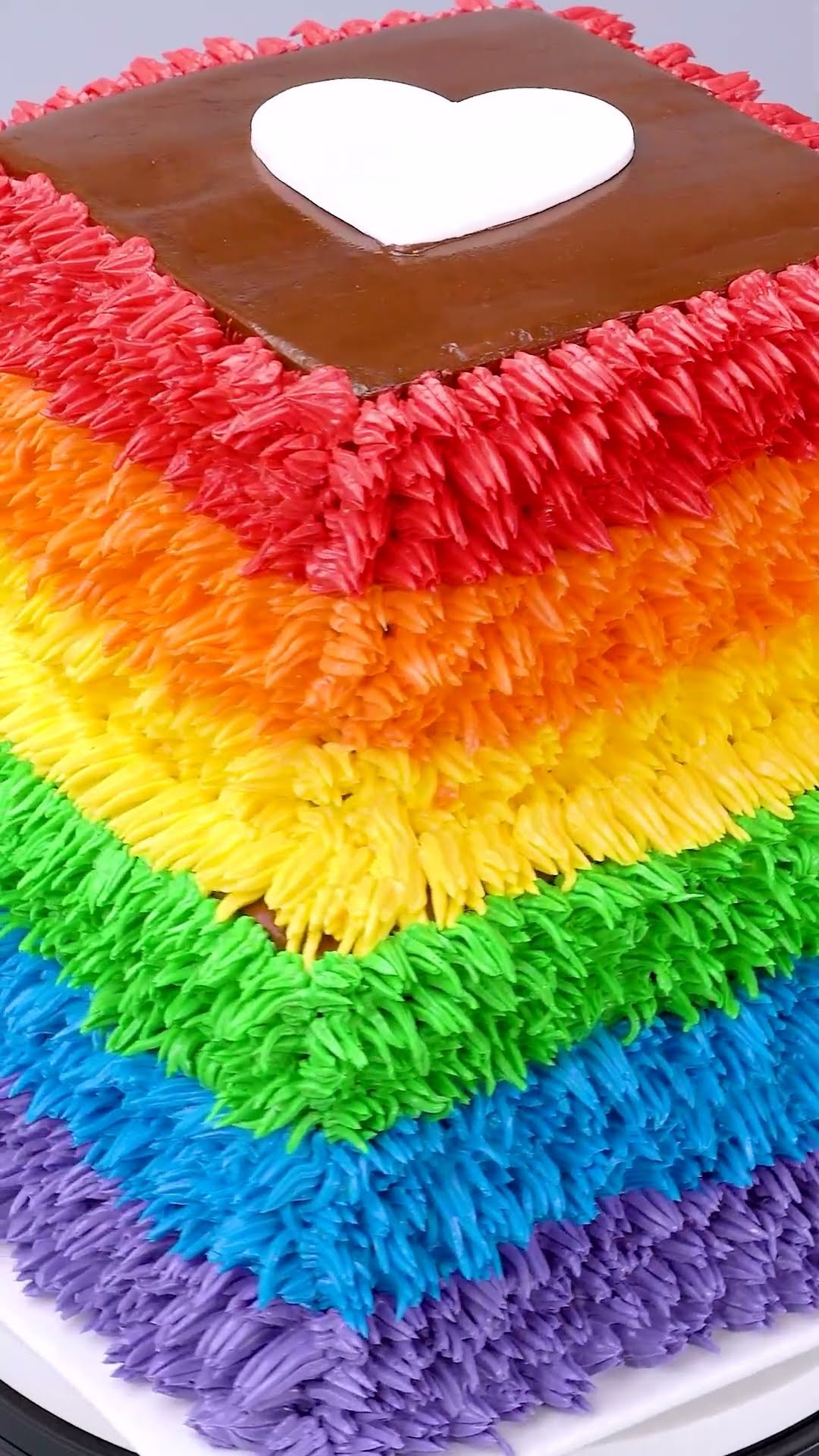 Designing a vibrant multi-colored square buttercream cake