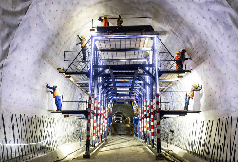 Workers in a tunnel in Kyrgyzstan, part of the 523km China-Kyrgyzstan-Uzbekistan Railway which is scheduled for completion in 2031. Photo: Xinhua