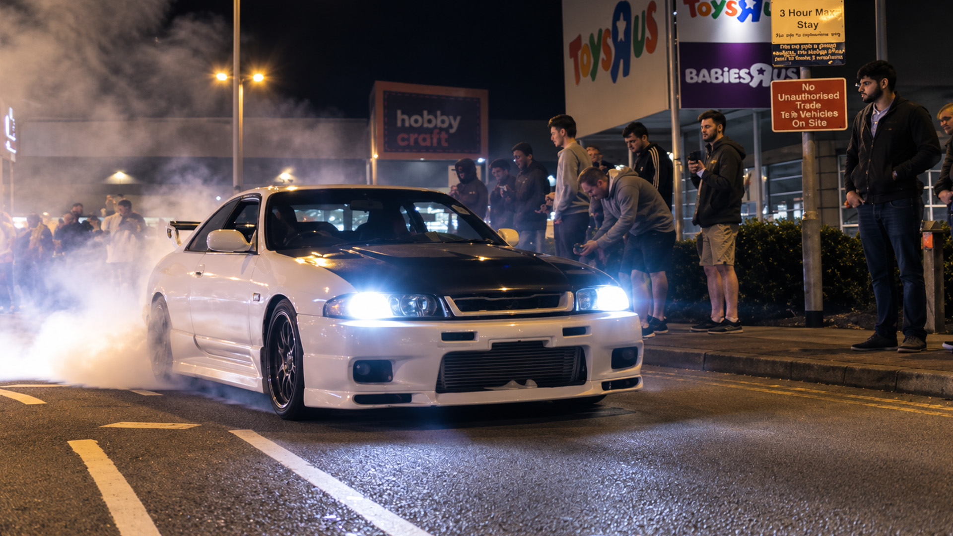 Burnouts create tense moments as tuner cars leave the meet