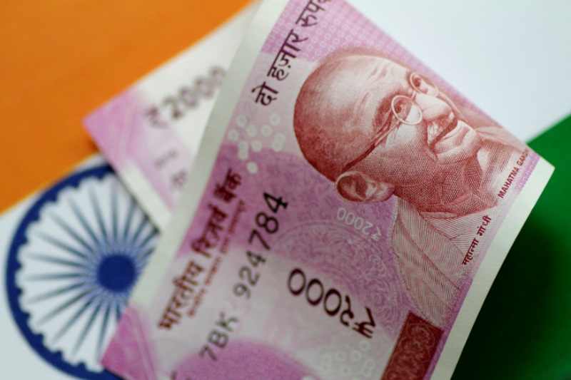 Rupee's oil-fuelled slide to persist, RBI support seen offering limited relief