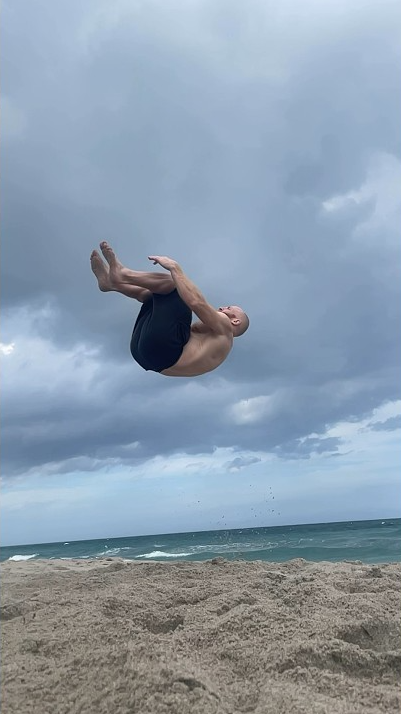 Slomo beach flip unreal slow motion aerial trick on the sand
