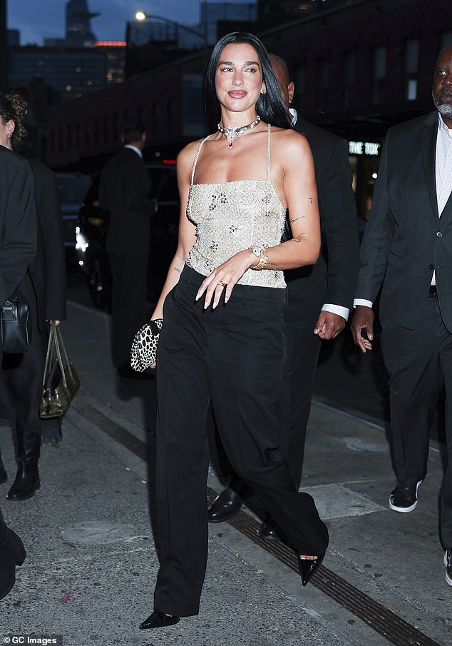 Dua Lipa and Callum Turner hold hands as they enjoy a New York date night at Bvlgari event