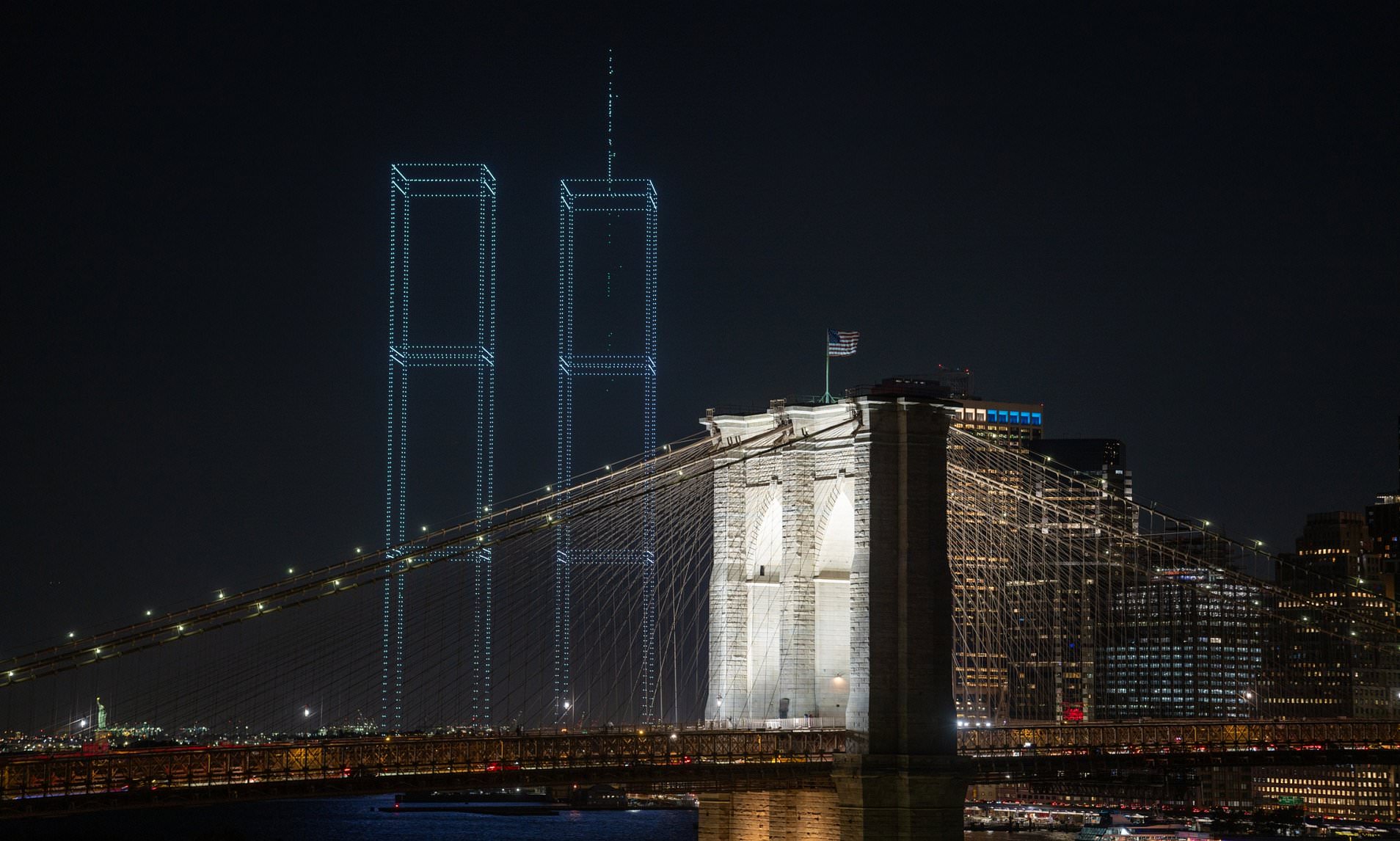 New York honours 9/11 by 'rebuilding' the Twin Towers with 2,977 light drones - one for every victim