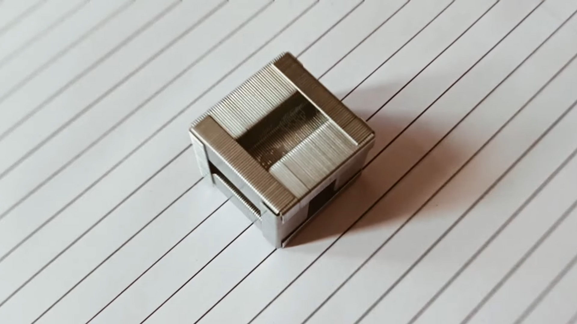 Crafting a unique cube from stapler pins step by step