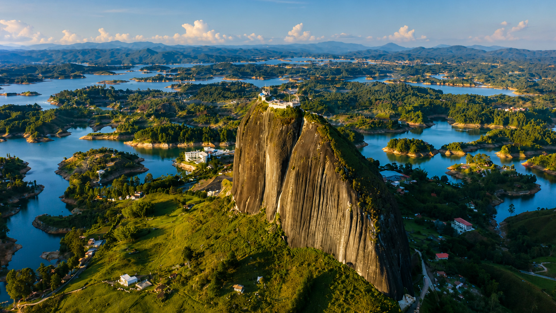 This giant rock has buildings at the top