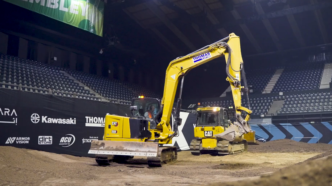 Heavy equipment operators show incredible skills inside the arena
