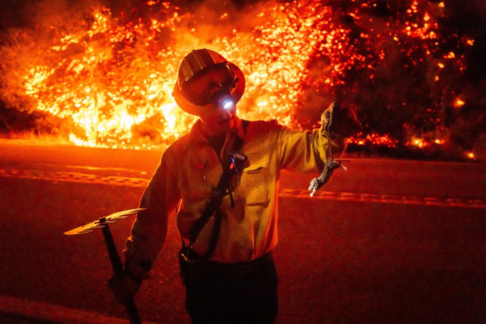 Fire in California's Big Sur region doubles in size overnight, forcing evacuations