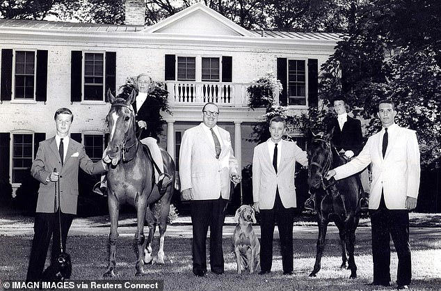 Owsley Brown II, Sara S Sally Brown, WL Lyons Brown, WL Lyons Brown, Jr, Ina Brown Bond, and Martin S Brown pose for a photo outside their family home in 1937