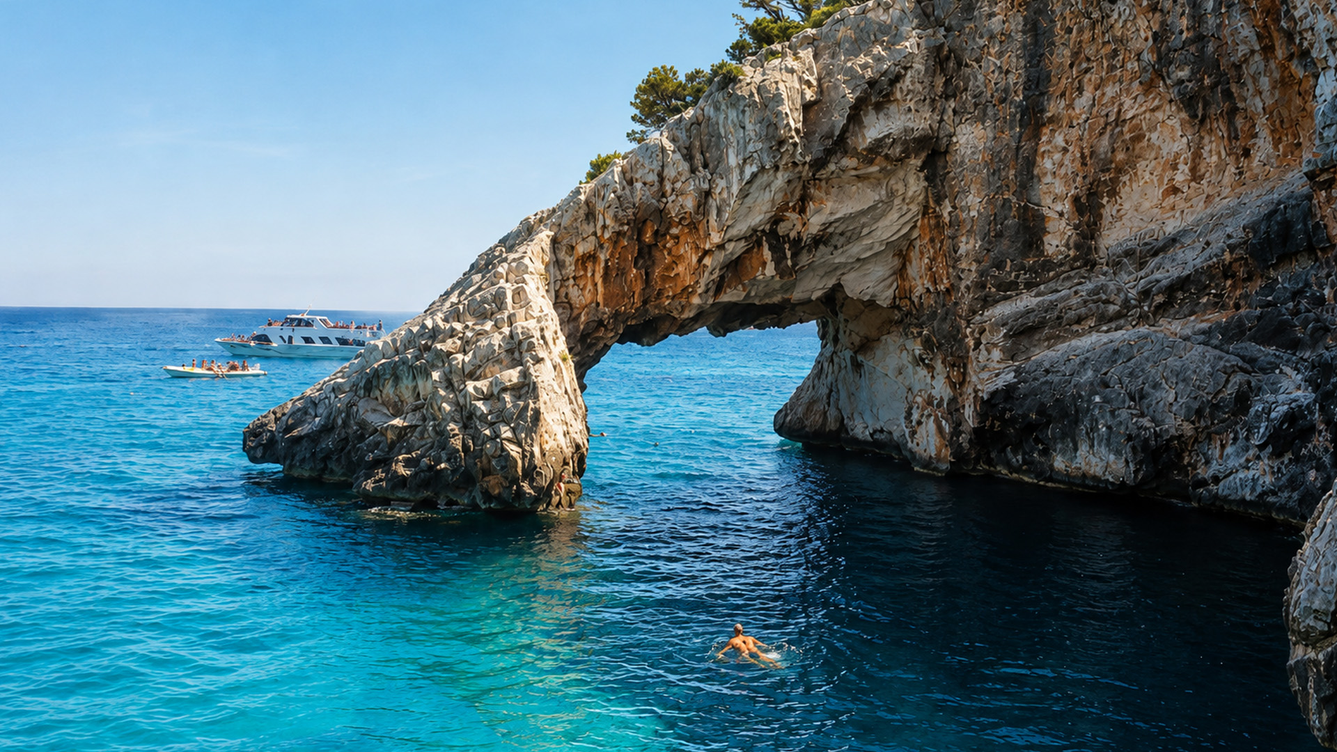 Boats gather around this unusual coastal formation