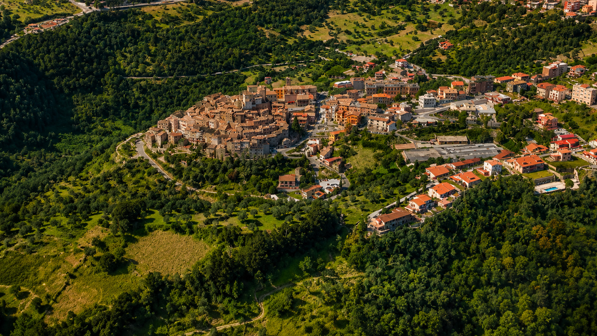 Italian hilltop village surrounded by green hills