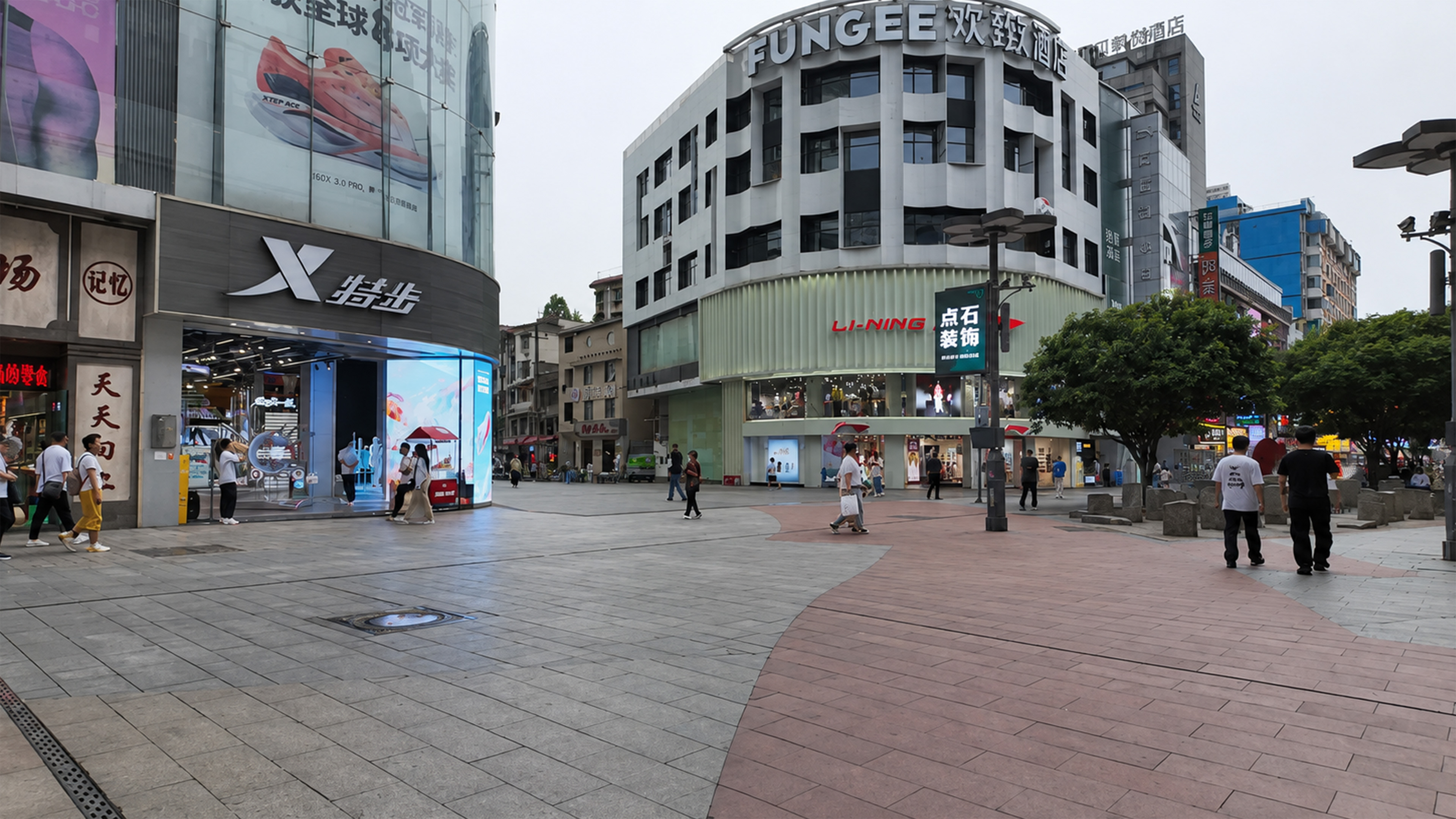 Modern shopping zone blends new retail with older Chinese buildings