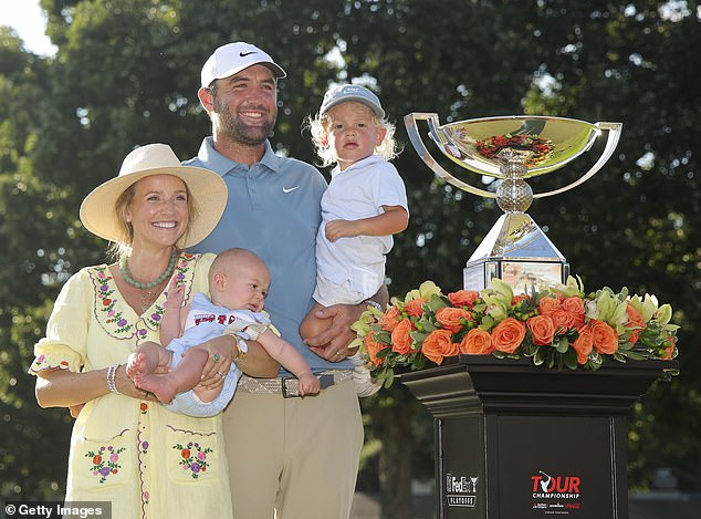 Scheffler poses with the trophy, wife Meredith Scheffler and sons, Bennett and Remy following the final round of the TOUR Championship 2026 at East Lake Golf Club on Sunday 