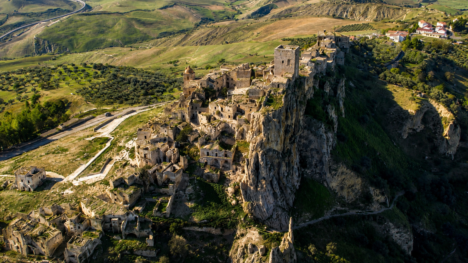 An old village slowly disappears into the mountain