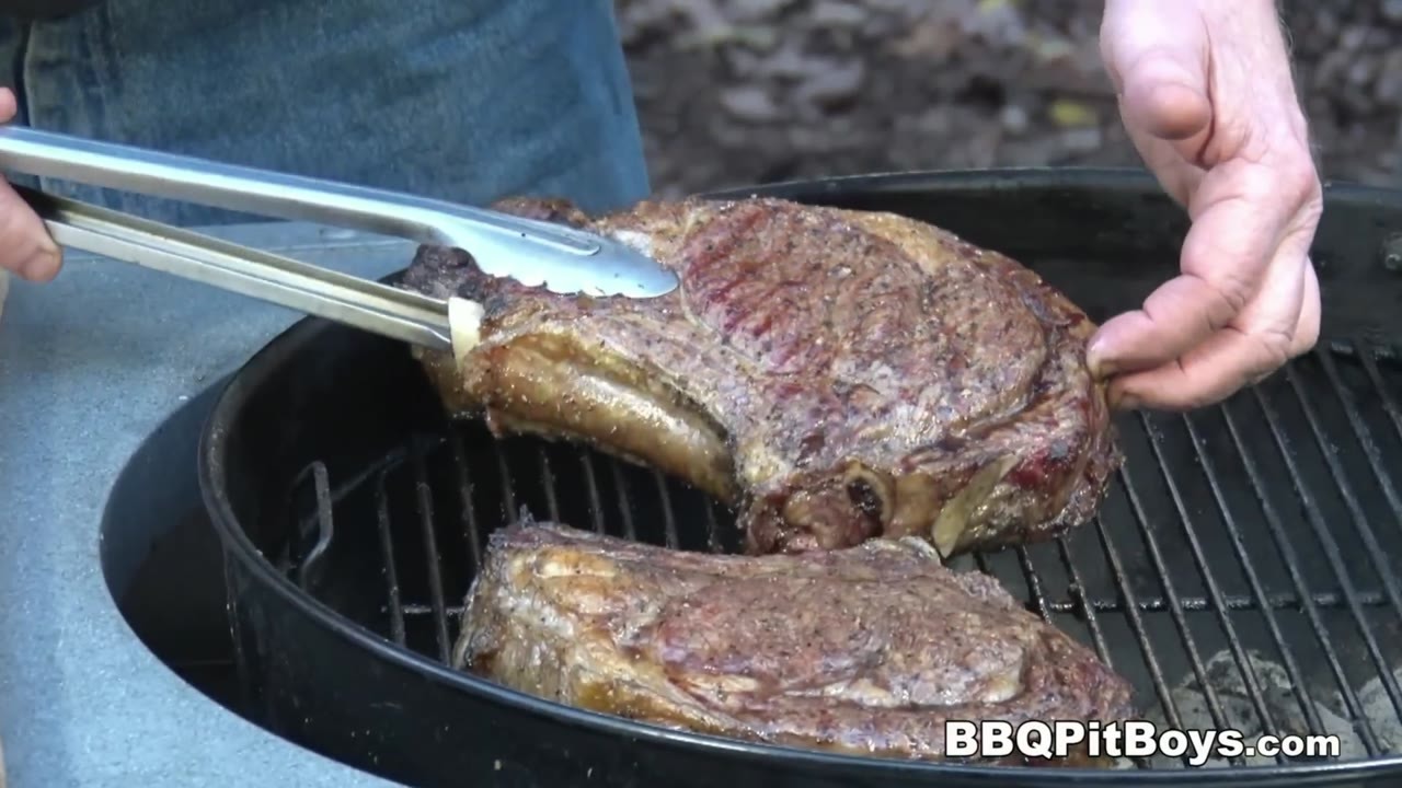 Pitmasters cut a whole rib roast into thick bone-in ribeye steaks