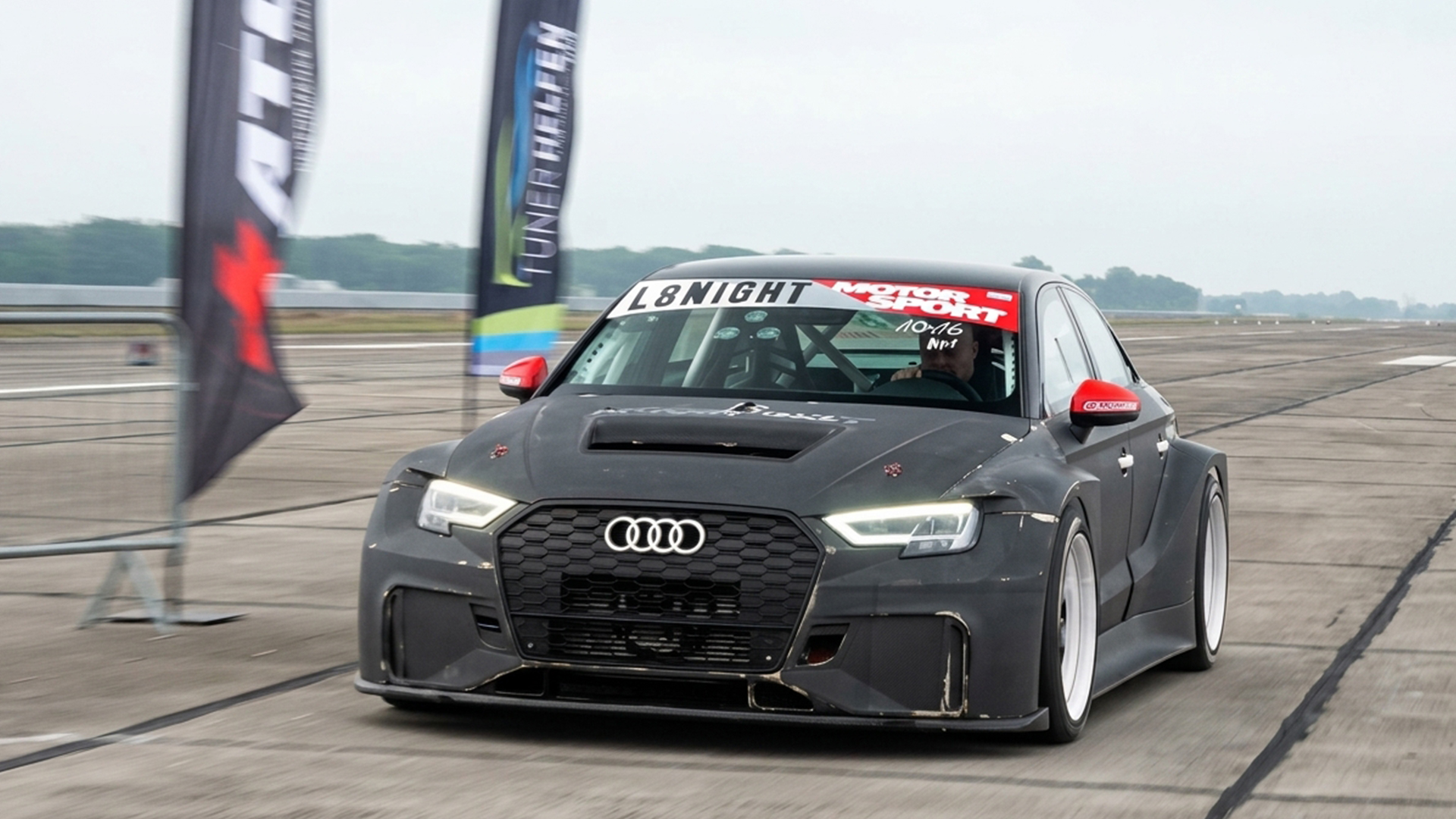 Widebody Audi RS3 arrives at a tuner event on a runway