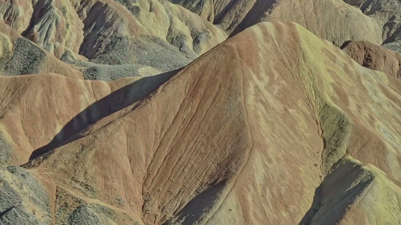 Danxia Mountain, China: Drone soars over red rock cliffs