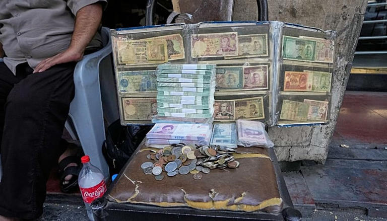Iranian rial in freefall as dollar breaks 2.1 million mark