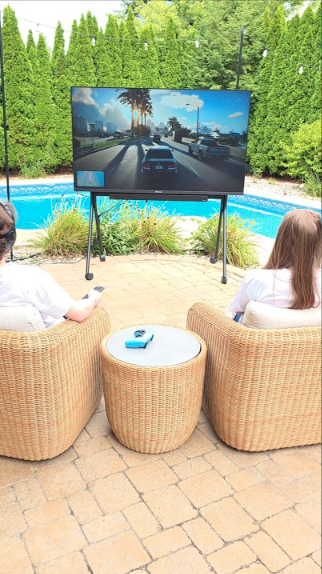 Ultimate outdoor gaming patio setup with TV and comfort