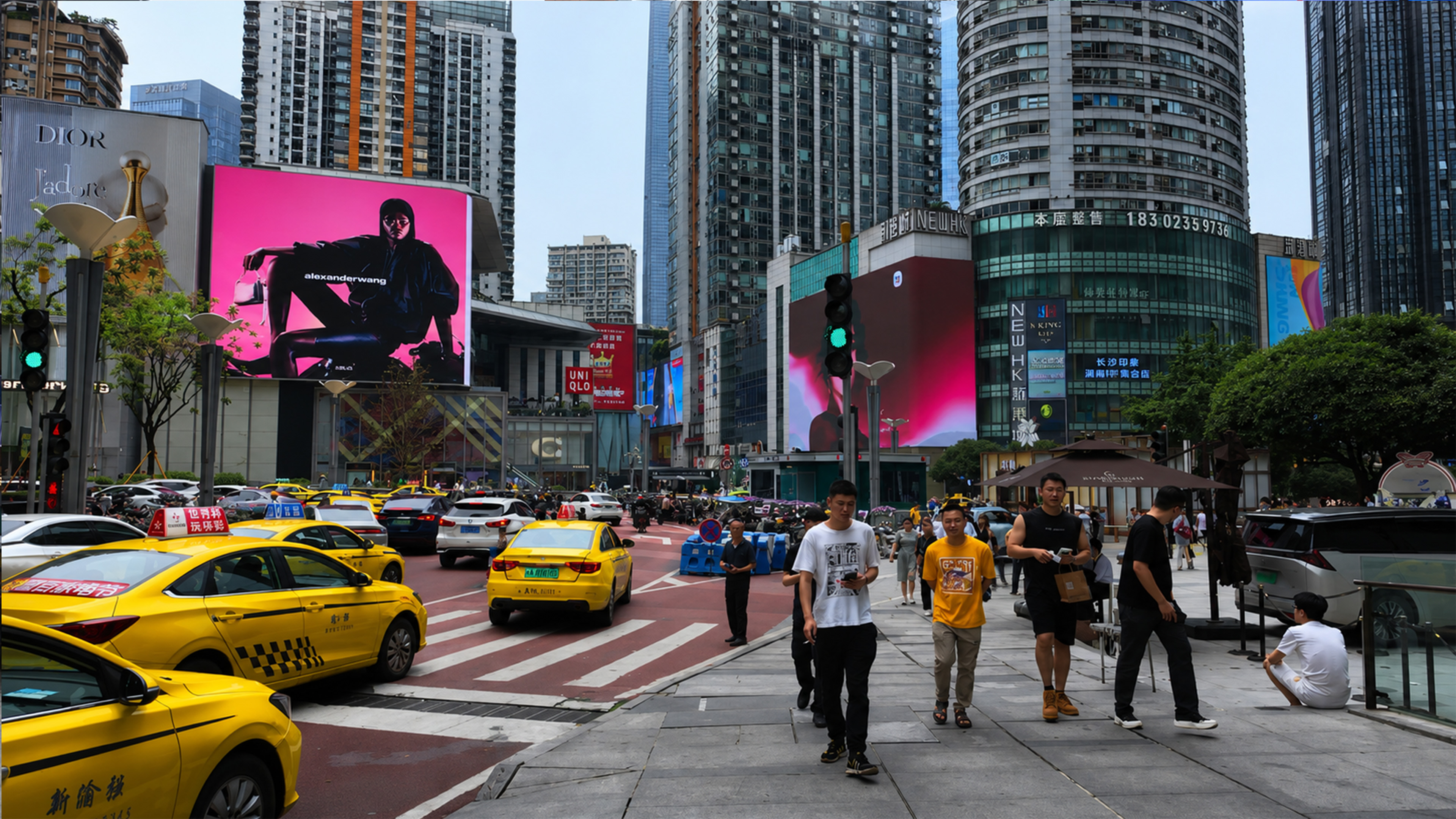 Fashion screens and yellow taxis define this downtown streetscape