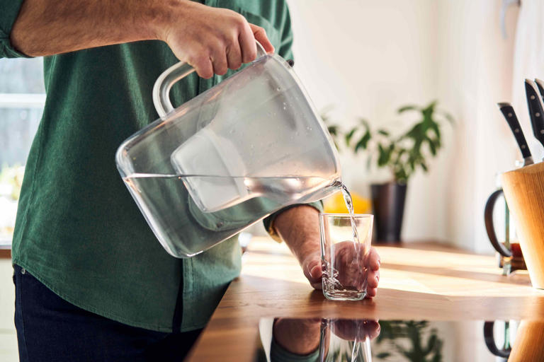 This sleek glass pitcher filters out forever chemicals and ...