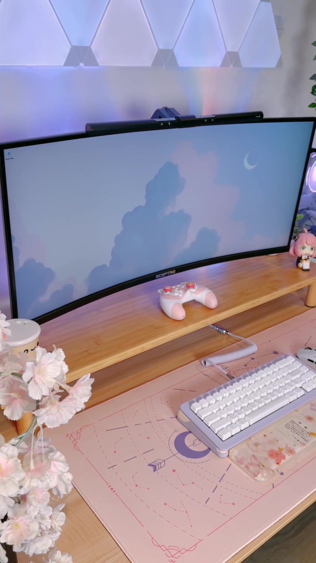 A bamboo monitor riser organizes this desk
