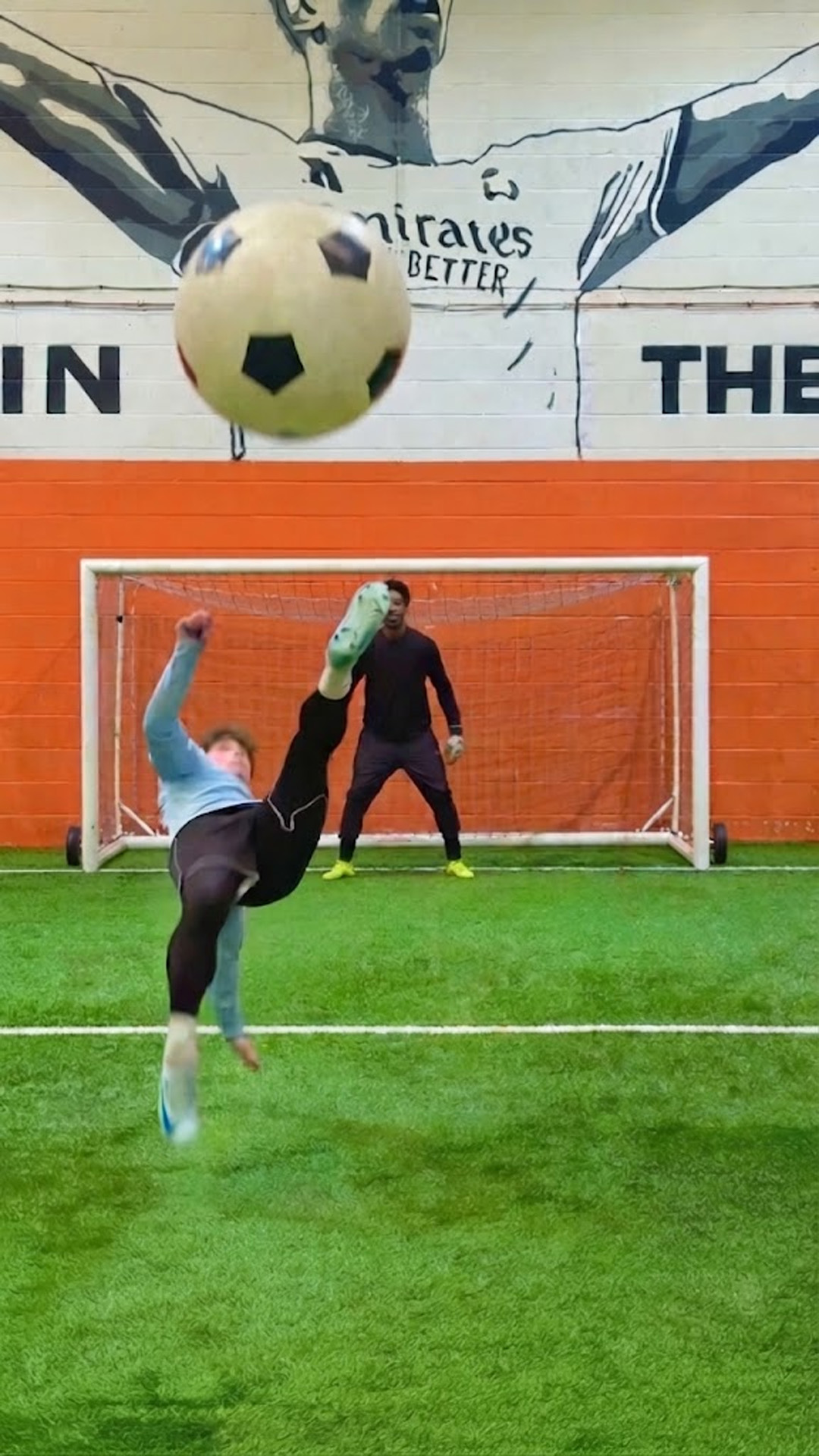 Attempting extremely difficult bicycle kicks and giant balls