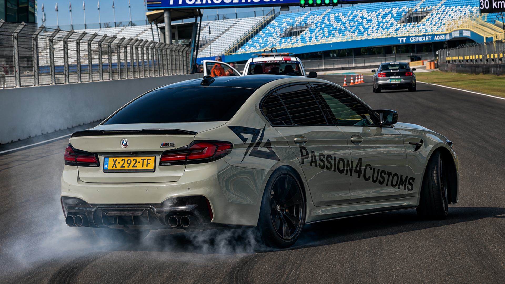 BMW M5 kicks up smoke at Circuit Assen
