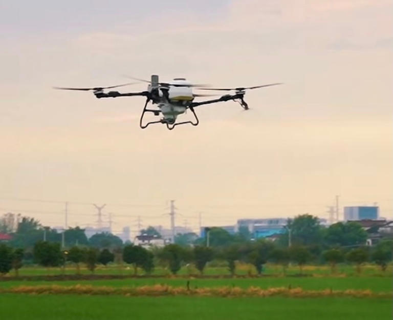 A drone waters a rice-prawn farm in the city of Wuhu in China's eastern Anhui province. Photo: Facebook/Mohamad Sabu
