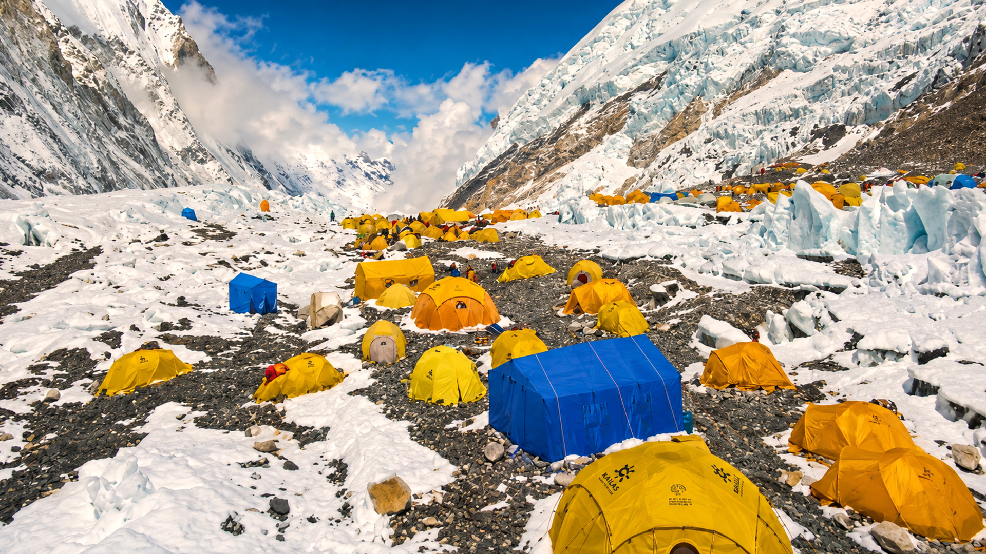 A tiny campsite beneath towering Himalayan peaks
