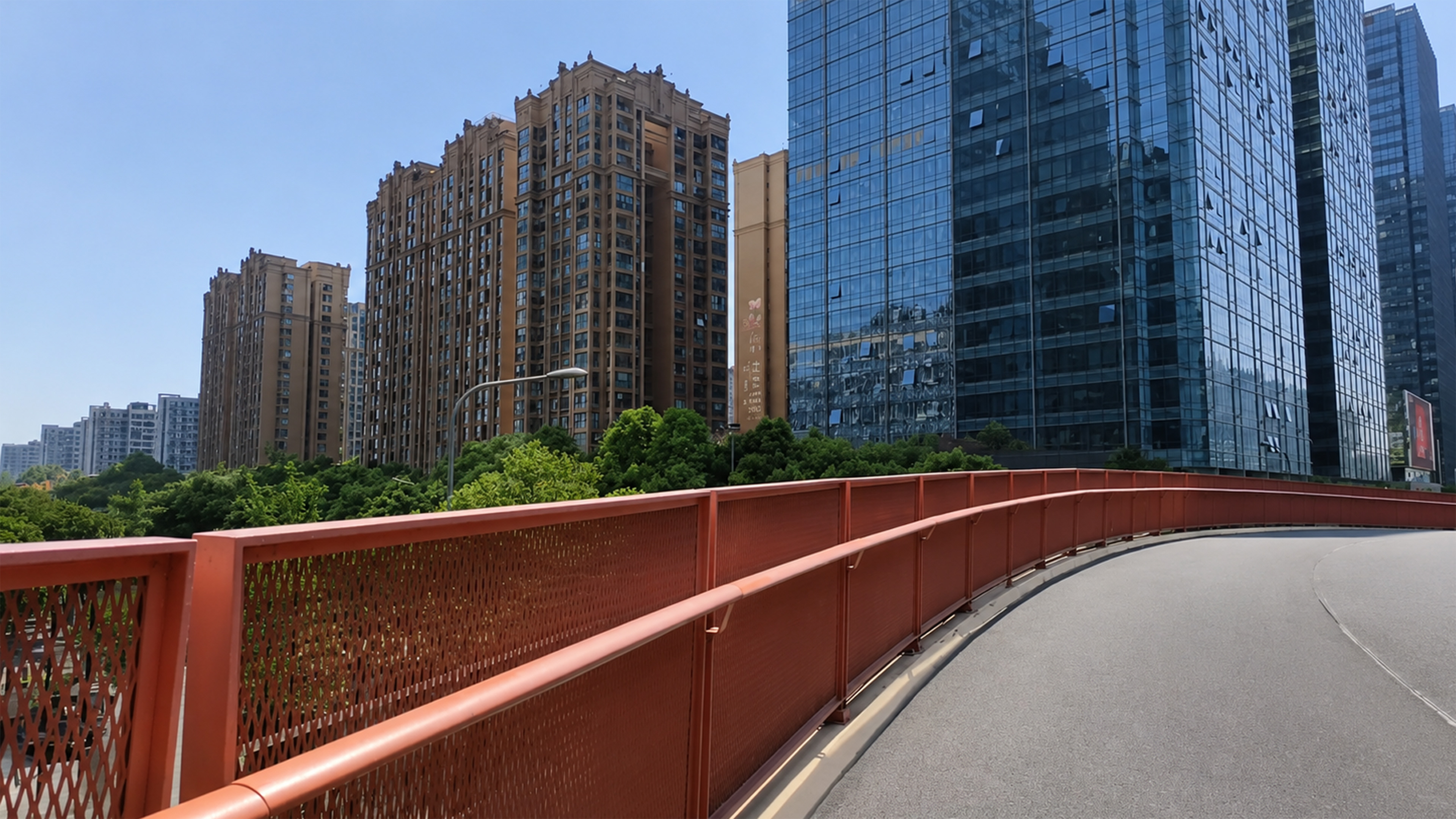 A curving red walkway leads toward Chengdu’s towering skyline