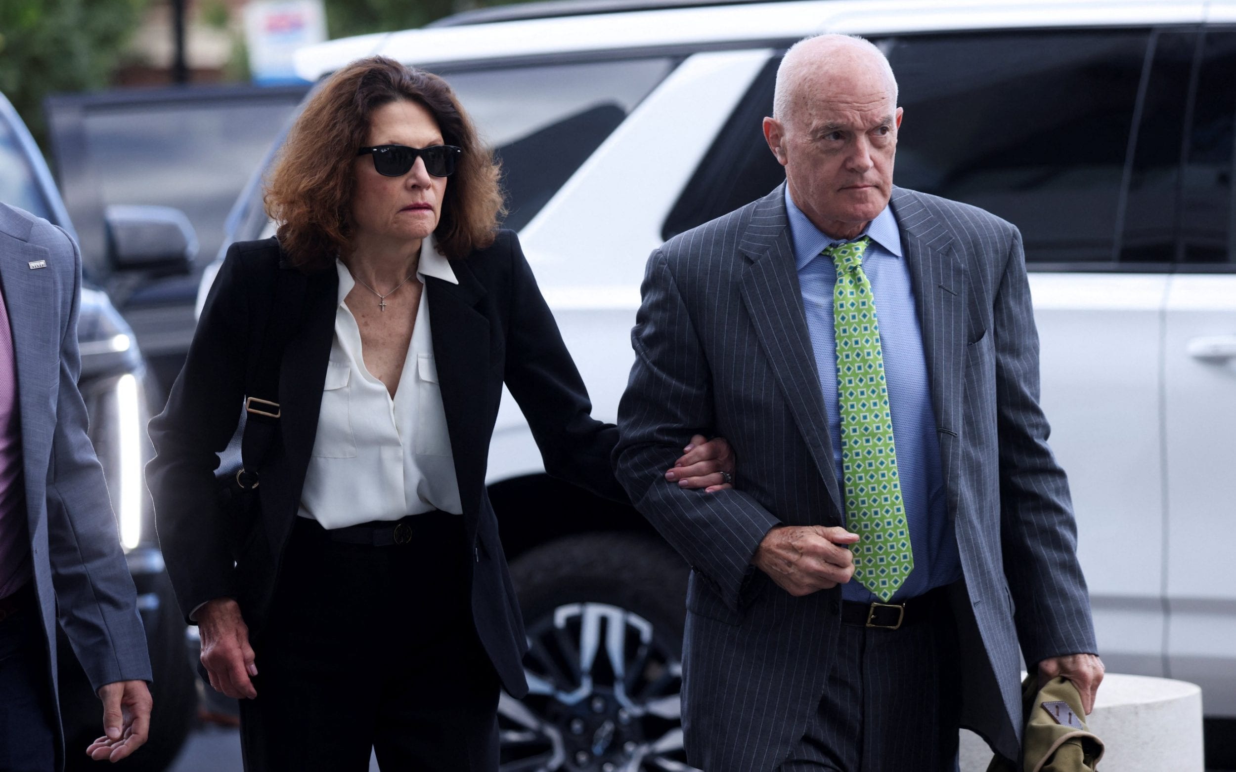 Charlie Kirk’s parents, Robert W Kirk and Kathryn Kirk, arrive for the court hearing - Reuters