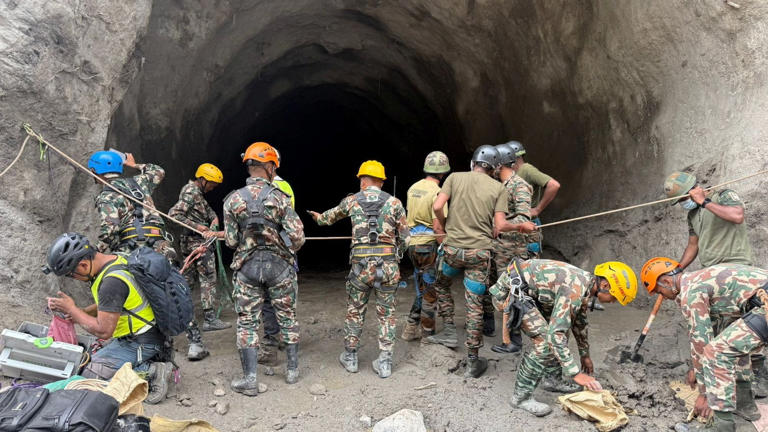Nepal army soldiers work during a search and rescue operation outside a tunnel near the Hydropower Project sites, following deadly flash floods and mudslides, in Rasuwa district, Nepal (Reuters)