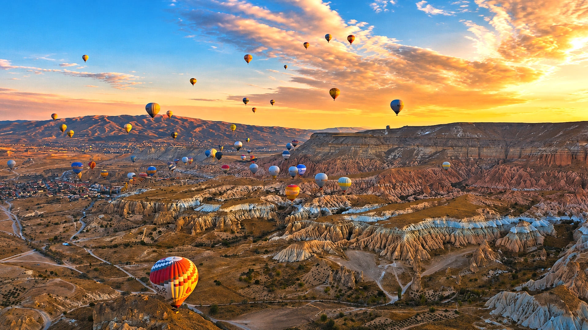 Hot air balloons floating above Cappadocia’s Rose Valley