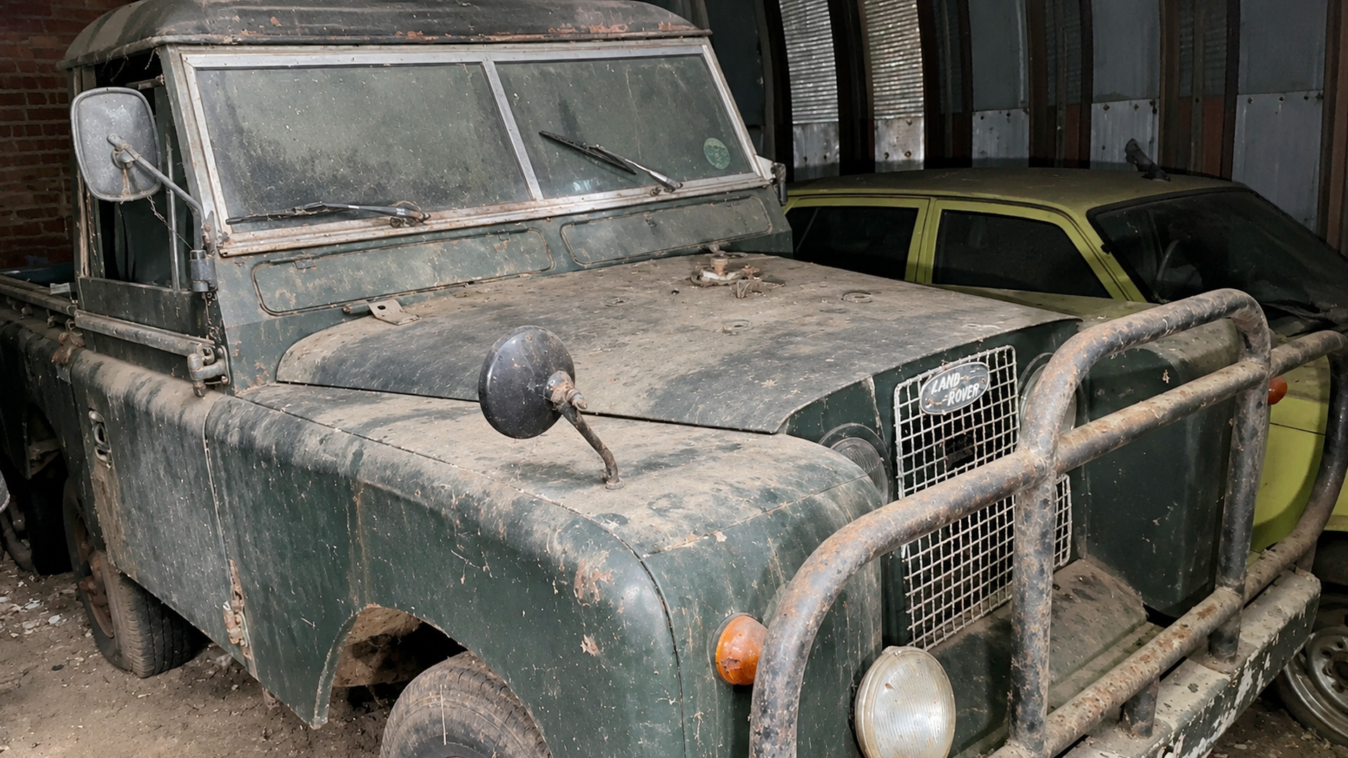 A hidden automotive collection still sits among old scrap metal