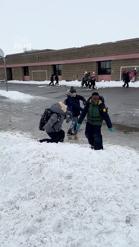 Elementary school children share a sweet classroom moment