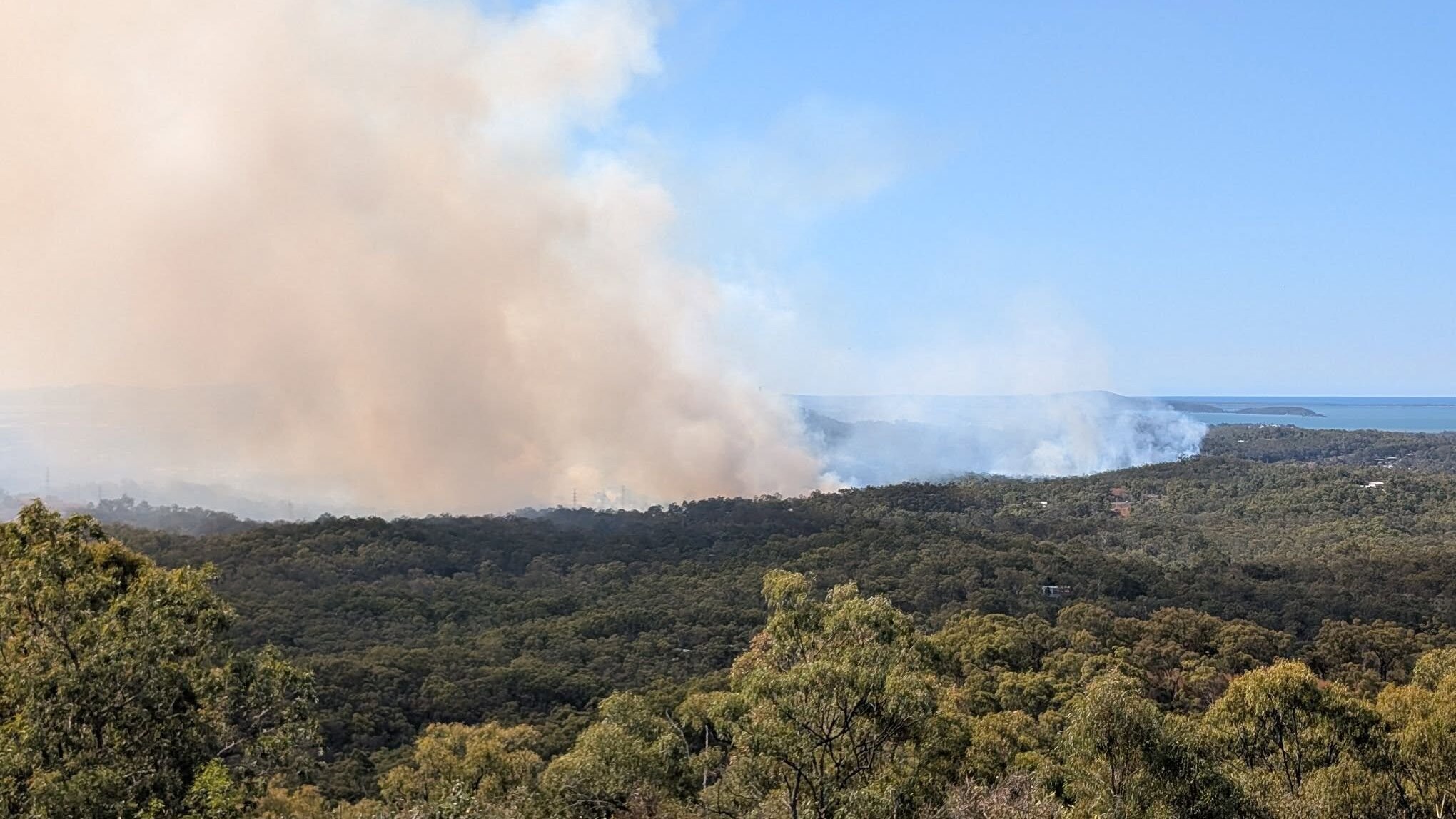 Queensland Fire Department crews work to control fire burning near Gladstone