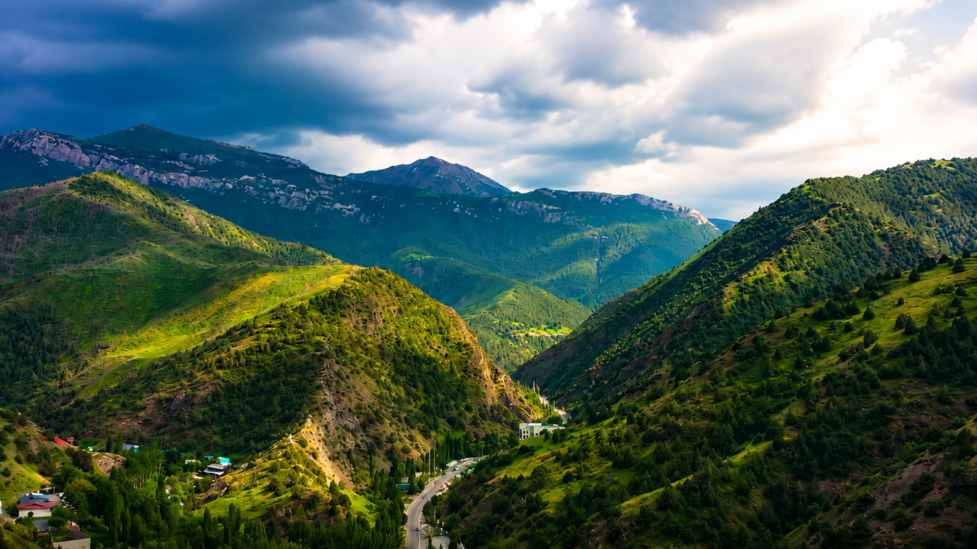 A narrow valley holds roads and small villages
