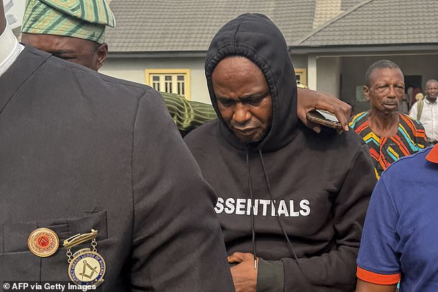 Adeniyi Mobolaji Kayode, 46, (pictured) has denied charges that include causing death by dangerous driving and driving without a valid national driver's licence